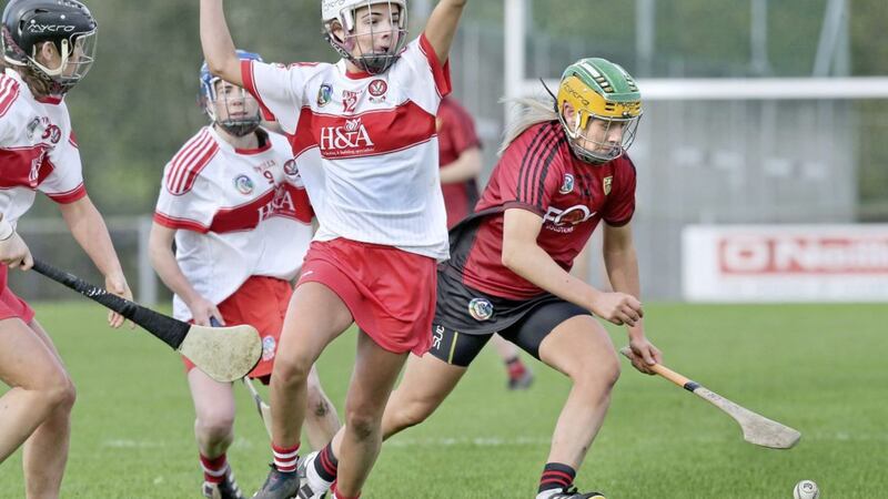 Lauren Clarke of Down challenges Derry Ceat McEldowney for possession during the All-Ireland Intermediate Camogie Championship match at Slaughtneil on Saturday October 24 2020. Picture by Margaret McLaughlin 