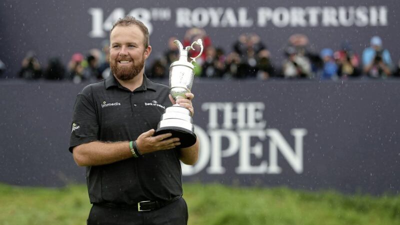 Shane Lowry celebrates with the Claret Jug after winning The Open at Royal Portrush Golf Club. 