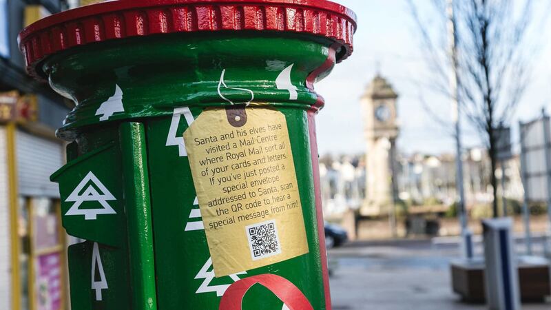 Four postboxes have been decorated as wrapped Christmas presents.