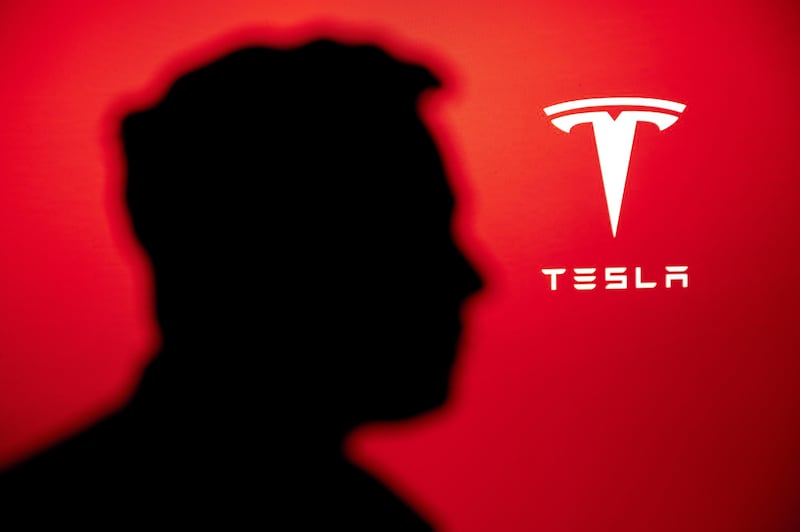 2KAE448 NEW YORK, USA, 2. OCTOBER 2022: Portrait of business magnate and investor Elon Musk, Tesla Company logo in background