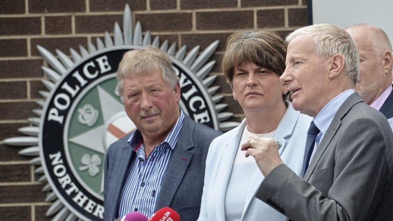 DUP leader Arlene Foster with Sammy Wilson and Gregory Campbell at PSNI headquarters on Tuesday. Picture by Colm Lenaghan/Pacemaker