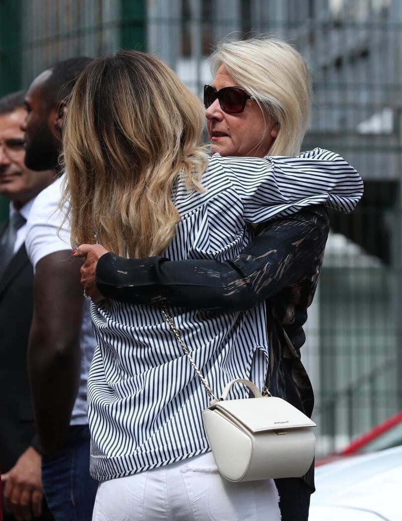 Montana Brown hugs Mike Thalassitis' mother Shirley after an inquest into his death (Yui Mok/PA)
