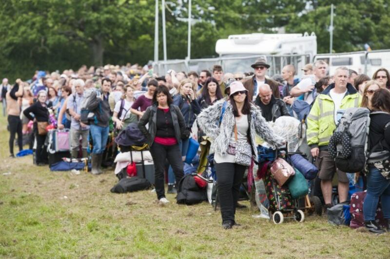 Festival goers queue for up to 3 hours to have their bags checked 