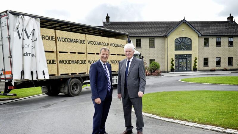 Dungannon based Woodmarque is successfully growing its business in Great Britain following investments in new equipment, business development and 16 new staff. Pictured are Jeremy Fitch, Invest NI, and Brian Quinn, Woodmarque 