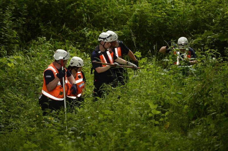 A Community Rescue Service team scours undergrowth close to the River Braid. Picture by Mark Marlow.