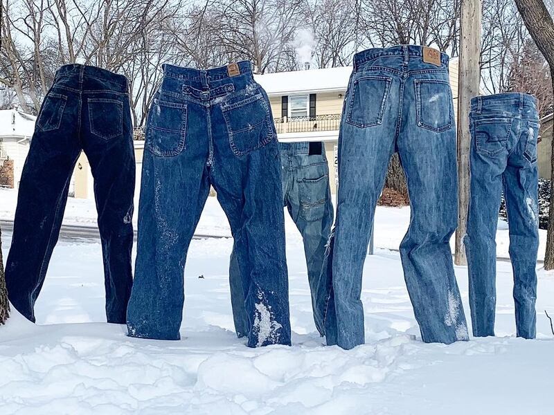 The pants in the snow, from behind