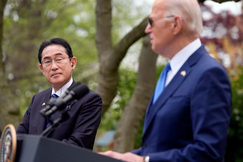 Mr Biden, right, was speaking alongside Japanese prime minister Fumio Kishida, left, who was in Washington for an official visit (Evan Vucci/AP)