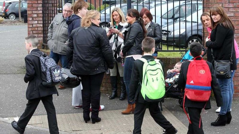 Parents outside the gates of De La Salle school in west Belfast. Picture Mal McCann 