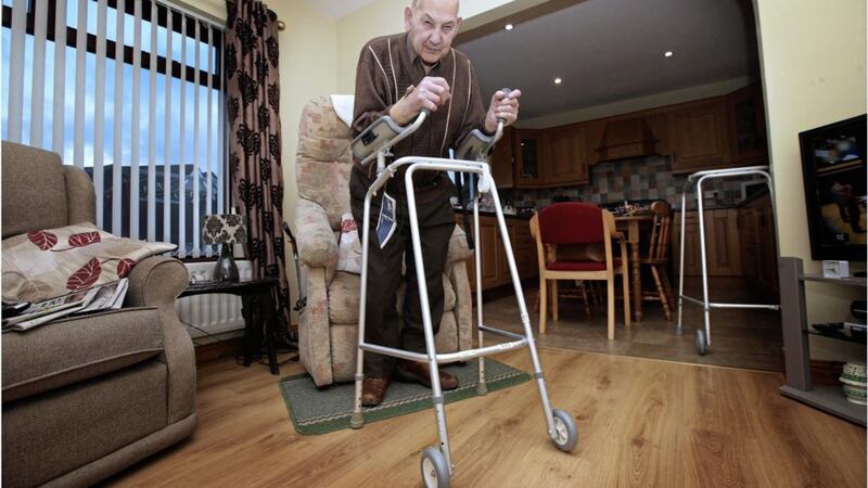 90-year-old Danny Murphy, who is on a lengthy hospital waiting list for a hip replacement, pictured in his Cushendun home. Picture by Hugh Russell 