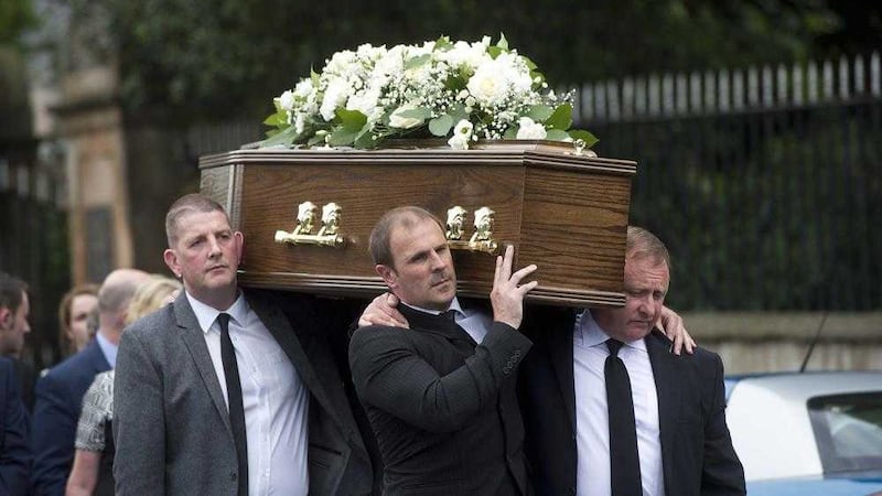 Winston Irvine carries the coffin at William &#39;Plum&#39; Smith&#39;s funeral 