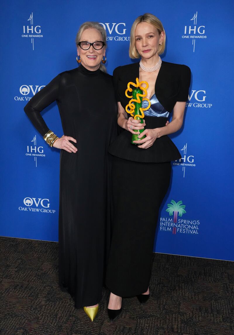 Meryl Streep, left, and Carey Mulligan, winner of the international star award for Maestro, pose in the press room at the 35th annual Palm Springs International Film Festival Awards Gala