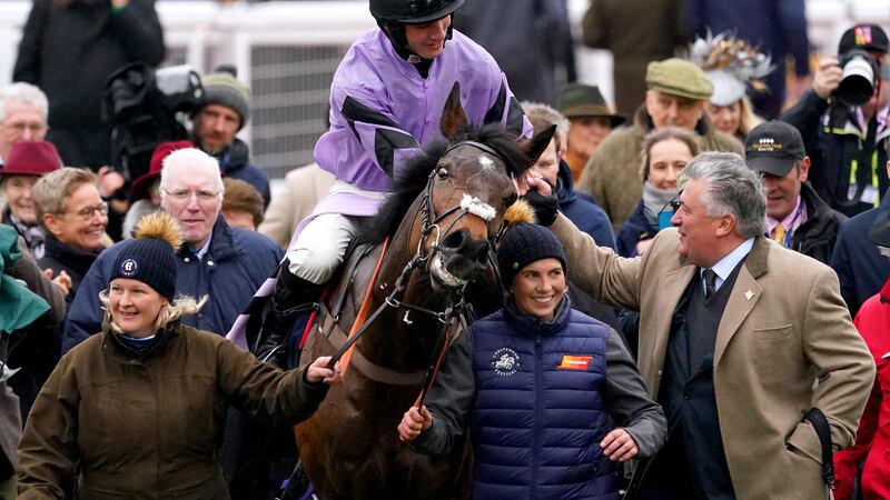 Jockey Harry Cobden shakes hands with trainer Paul Nicholls after winning the Turners Novices' Chase on Stage Star on day three of the Cheltenham Festival at Cheltenham Racecourse. 