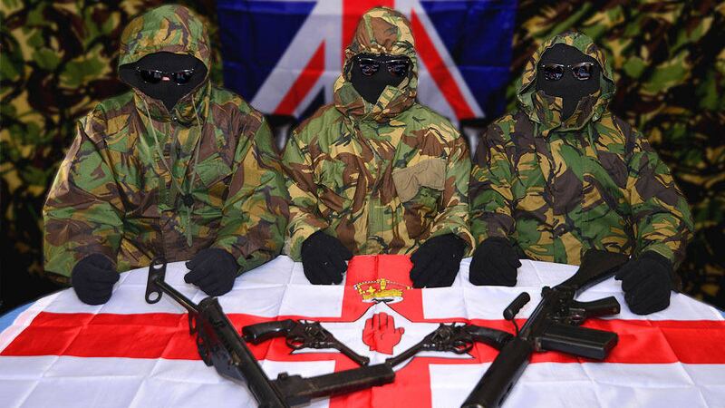 Three members of an unnamed loyalist group in a photograph released to the media yesterday 