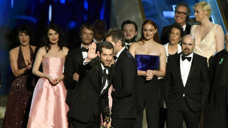 Writers D. B. Weiss, left, David Benioff, and the cast and crew of Game of Thrones accept the award for outstanding drama series at the Emmy Awards. Picture by Chris Pizzello/Invision/AP 