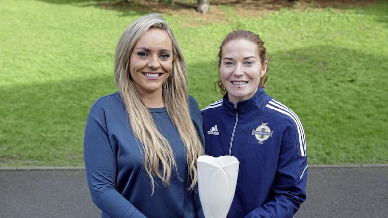 Cliftonville&#39;s Marissa Callaghan (right) receives her player of the month award from NI Football Writers&#39; Association chairperson Ruth Gorman. 