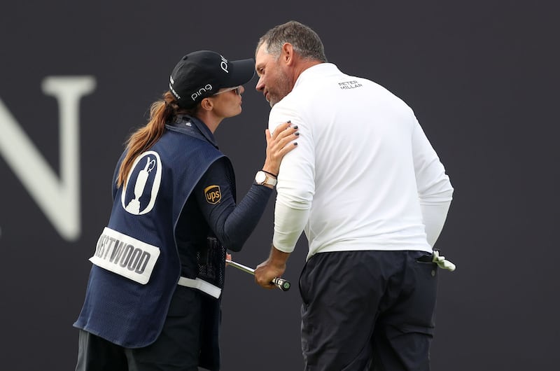 England's Lee Westwood kisses his girlfriend and caddie Helen Storey after his birdie on the 18th during day one of The Open Championship 2019 at Royal Portrush Golf Club onThursday July 18, 2019. Picture by Richard Sellers/PA Wire.