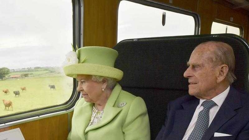 Queen Elizabeth and the Duke of Edinburgh travel by steam train along the North Antrim coast from Coleraine to Bellarena&nbsp;