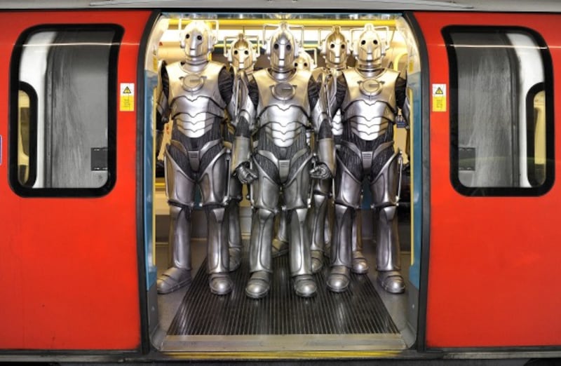 A group of Cybermen on the London Underground