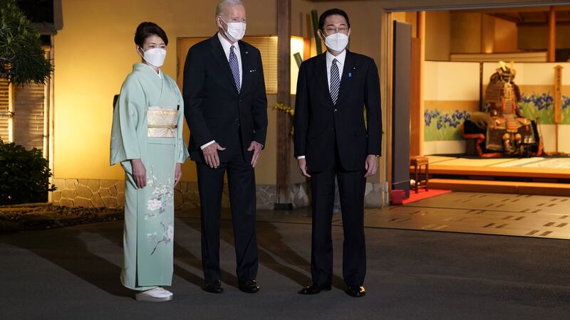 US president Joe Biden (centre) is greeted by Japanese prime minister Fumio Kishida (right) and his wife Yuko as he arrived for dinner at Kochuan, Monday, May 23, 2022, in Tokyo (AP Photo/Evan Vucci)&nbsp;