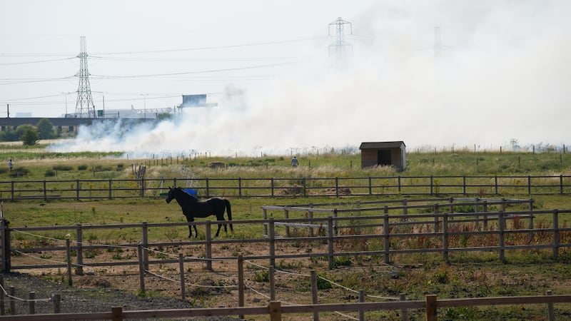 Smoke pours from a blaze in the village of Wennington, east London. Picture by Yui Mok, Press Association
