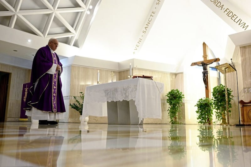 Pope Francis celebrating Mass alone at his Santa Marta residence in the Vatican yesterday; the Church has issued fresh guidelines on how clergy are to celebrate Easter amid the coronavirus pandemic, with no faithful present. Picture by Vatican News via AP 