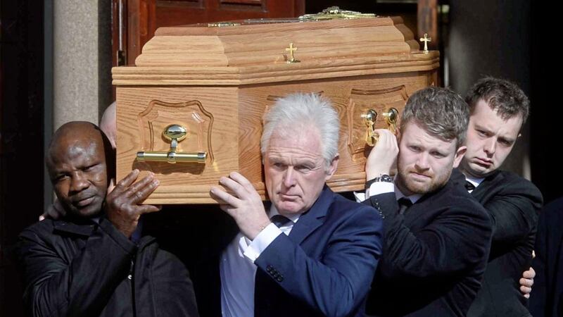 The funeral of Barney Eastwood took place in Holywood. Pictured front are Danny Juma and Mr Eastwood's son Peter. Picture by Mark Marlow