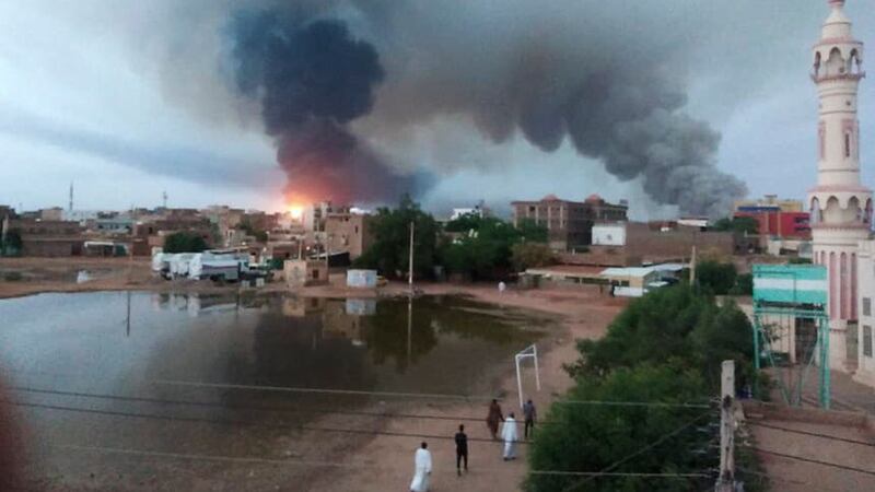 Smoke rises over Khartoum on Wednesday (AP)