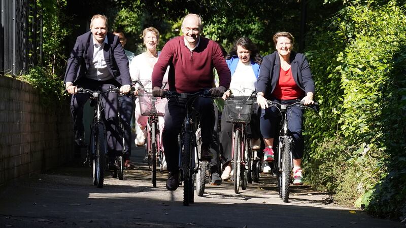 Lib Dem leader Sir Ed Davey alongside West Country MPs and key candidates as they arrive by bicycle for the Liberal Democrat conference at the Bournemouth Conference Centre (Stefan Rousseau/PA)