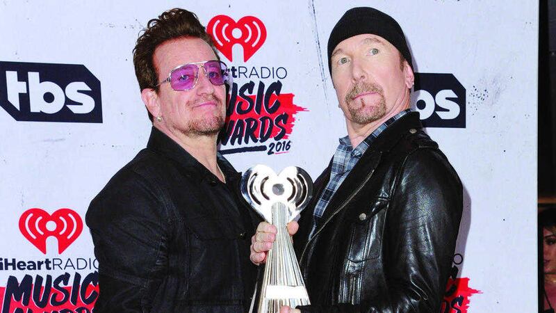 Bono and The Edge of U2, winners of the innovator award pose in the press room at the iHeartRadio Music Awards in Inglewood, California. Picture by Richard Shotwell, Invision/Associated Press