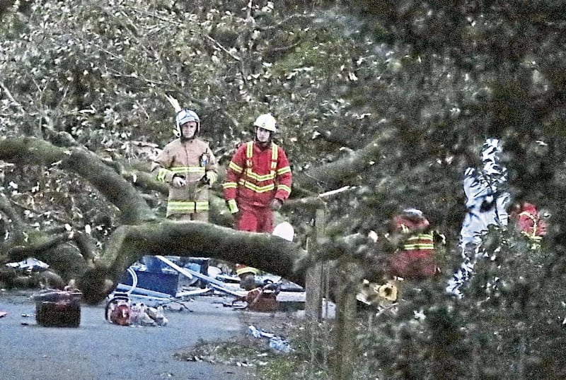 PRAYERS: Emergency services and a forensic officer at Slieve Gullion forest park in Co Armagh on Wednesday 