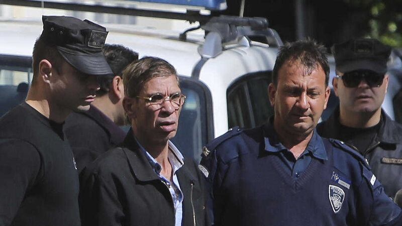 Cyprus police escort hijacking suspect Seif Eddin Mustafa from court PICTURE: Petros Karadjias/AP 