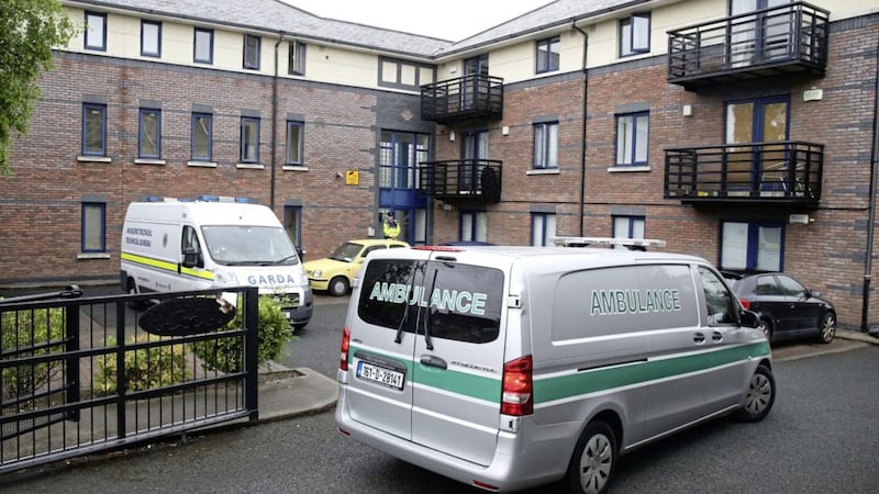 A coroner&#39;s ambulance arrives at an apartment complex in Kimmage, Dublin, where a three-year-old boy was found dead following a stabbing. Picture by Niall Carson, Press Association 