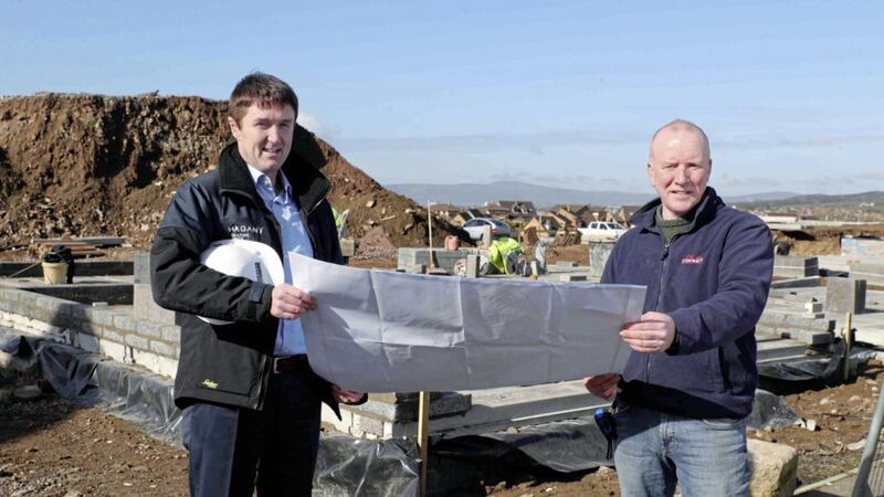 Pictured at Ballyoran Heights in Dundonald are Jim Burke (left), director of sales and acquisitions at Hagan Homes, and Liam McMahon, site manager of DB Building Contracts. Photo: Kelvin Boyes/Press Eye 