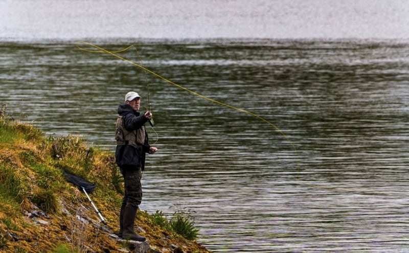 &nbsp;An angler fly fishing on the bank of Ballysallagh Lower Reservoir. Picture by Liam McBurney, Press Association