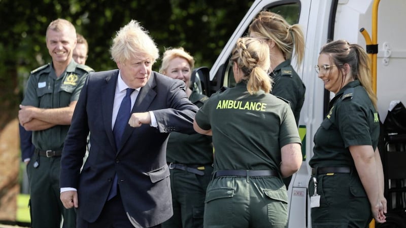 British prime minister Boris Johnson fist bumps a paramedic at the Northern Ireland Ambulance Service HQ during his visit to Belfast earlier this month. Picture by Brian Lawless/PA Wire