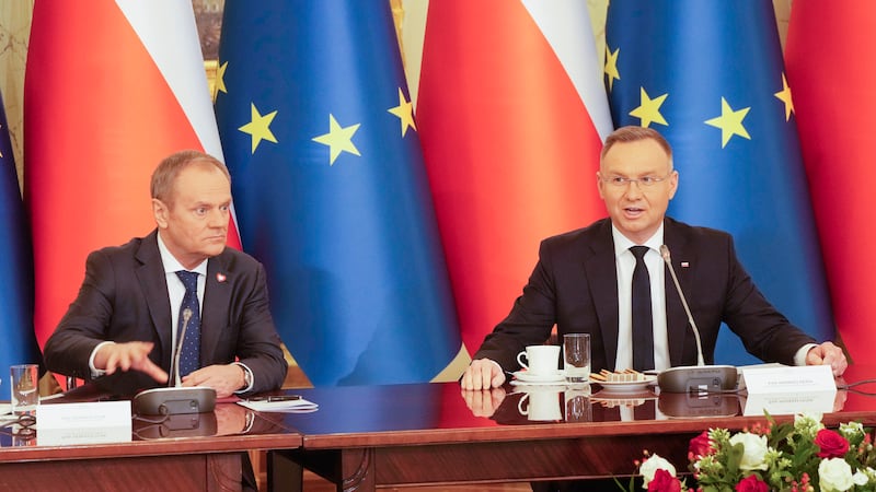 Poland’s Prime Minister Donald Tusk, left, and President Andrzej Duda attend a meeting of the Cabinet Council, a consultation format between the president and the government (Czarek Sokolowksi/AP)