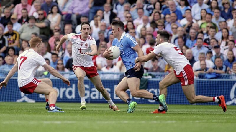Dublin&#39;s Brian Howard tries to evade the close attentions of Tyrone&#39;s Colm Cavanagh, Peter Harte and Tiernan McCann in the 2018 All-Ireland Senior Football Championship final at Croke Park, Dublin. Picture by Seamus Loughran. 