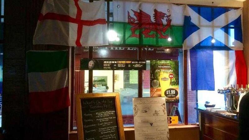 Wetherspoons in Lisburn has said a tricolour was removed from its Six Nations rugby display after staff and the pub received threats. 