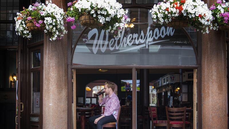 Wetherspoon sales lifted over the past three months as it hailed strong demand for Guinness