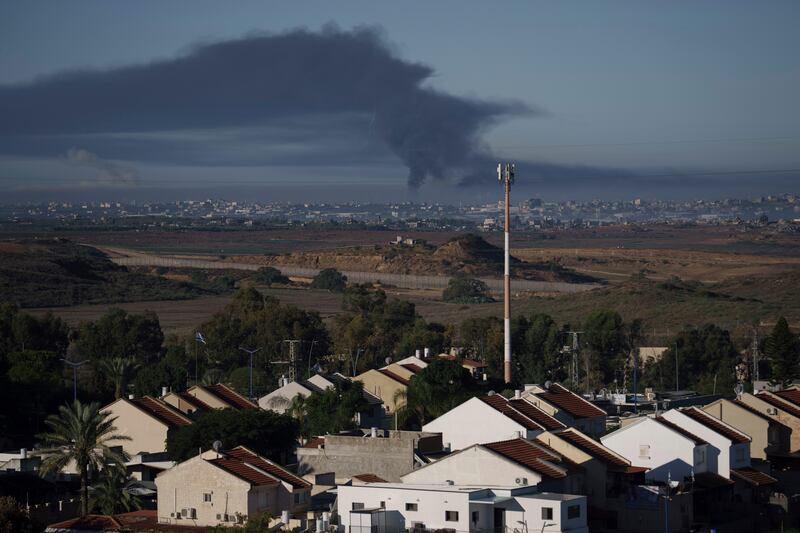 Smoke rises following an Israeli bombardment in the Gaza Strip, as seen from southern Israel, on Friday (Leo Correa/AP)