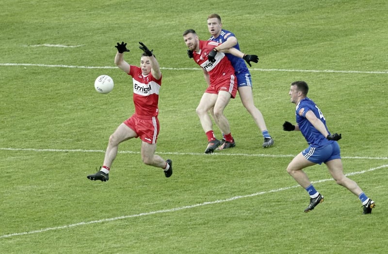 Ryan Wylie (right) of Monaghan closes down Derry&#39;s Niall Toner. Picture Margaret McLaughlin 
