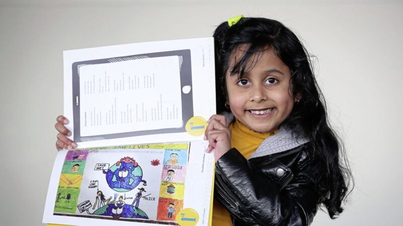 Koushikha Dontham (7), a P3 pupil from Lisnasharragh Primary School, whose colourful drawing is the first entry in the booklet. Picture by Kelvin Boyes / Press Eye 