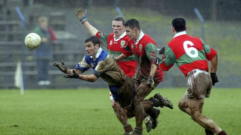 Where there&#39;s muck there&#39;s brass... Declan Bateson of Ballinderry first to the ball ahead of Eamon Franey, Mark Coffey and Trevor Doyle of Rathnew, during the AIB All-Ireland Senior Club Football Championship semi-final at Pearse Park in Longford in 2002. Photo by David Maher/Sportsfile 