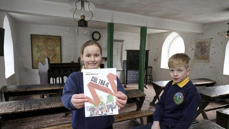 Madison Moore and Daire McElroy, from Gaelscoil Aodha Rua in Dungannon, Co Tyrone, with the C&uacute;l Tr&aacute;-il booklet 