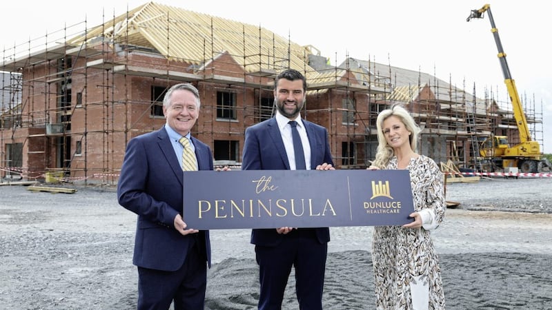 Unveiling plans for The Peninsula nursing home in Newtownards are (from left) Dr Kevin Moore, director of nursing; Ryan Smith, chief executive at Dunluce Healthcare; and Dianne Hunter, asset manager. Picture: Darren Kidd/PressEye 
