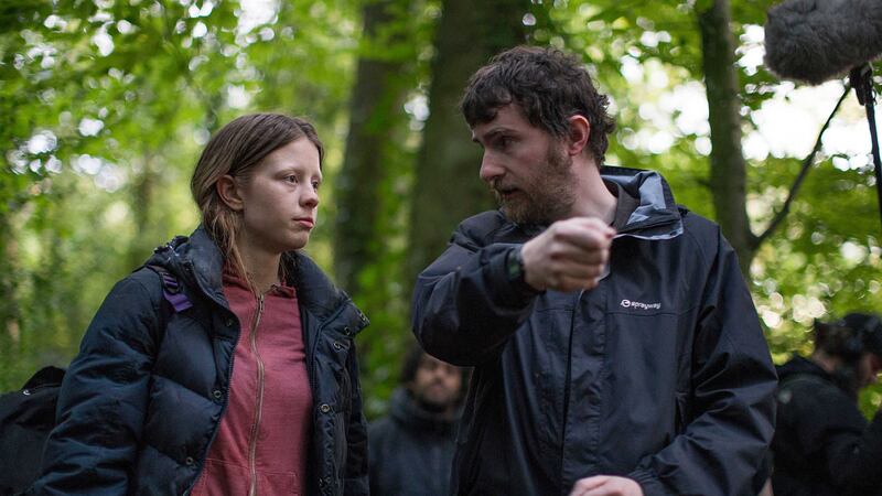 Writer and director Stephen Fingleton on the set of The Survivalist with actress Mia Goth &nbsp;