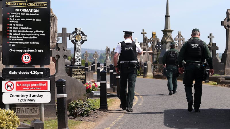 Police pictured at Milltown Cemetery this afternoon&nbsp;