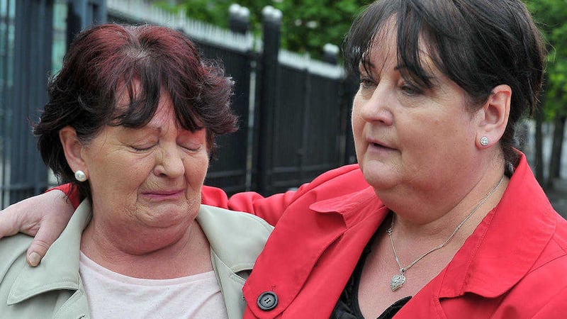Kyle Neil's grandmother Deborah Houston and his aunt Janette Morrison comfort each other as they leave Belfast's Laganside Court