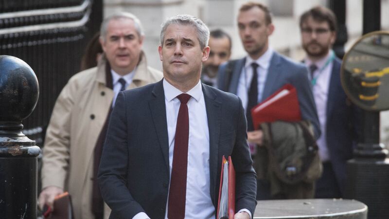 Britain's Brexit secretary Stephen Barclay leads his team out of his office including Attorney General Geoffrey Cox (left) as they leave Downing St in London for Brussels
