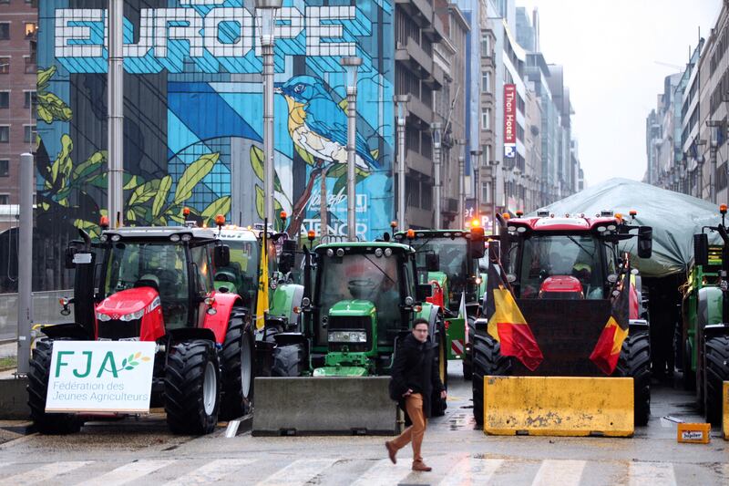 Tractors parked behind a blockade in the European Quarter during a protest of farmers outside a meeting of EU agriculture ministers in Brussels in February (Nicolas Landemard/AP)
